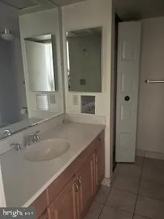 a kitchen with stainless steel appliances a refrigerator and a stove top oven