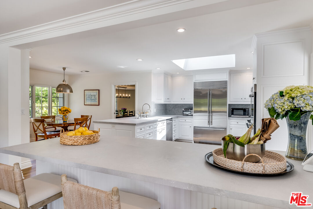 28925 Cliffside Drive Malibu, CA 90265 - Photo 13 of 62 a living room with furniture and a potted plant