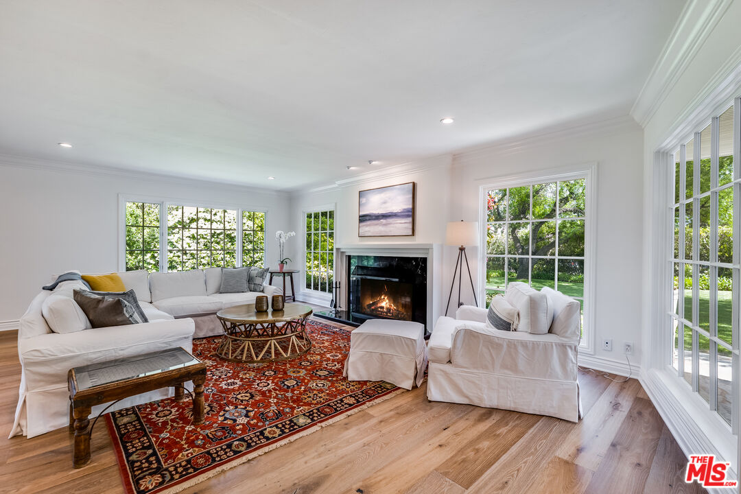 28925 Cliffside Drive Malibu, CA 90265 - Photo 18 of 62 a living room with furniture and a fireplace