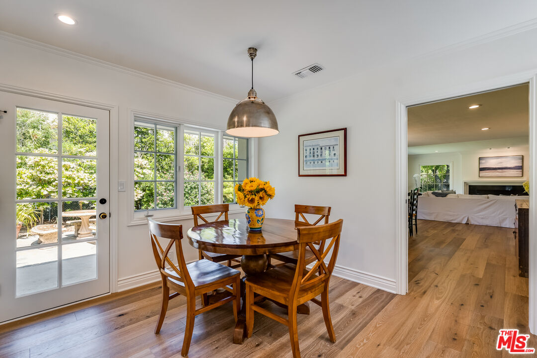 28925 Cliffside Drive Malibu, CA 90265 - Photo 24 of 62 a view of a dining room with furniture window and wooden floor