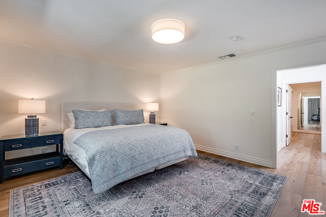 28925 Cliffside Drive Malibu, CA 90265 - Photo 26 of 62 a bedroom with a bed and a night stand