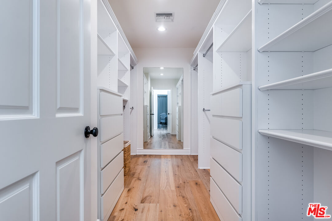 28925 Cliffside Drive Malibu, CA 90265 - Photo 29 of 62 a view of a hallway with wooden floor and staircase