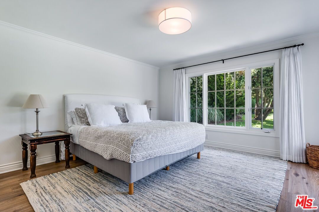 28925 Cliffside Drive Malibu, CA 90265 - Photo 30 of 62 a bedroom with a bed and a window