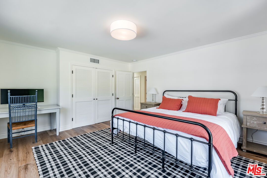 28925 Cliffside Drive Malibu, CA 90265 - Photo 33 of 62 a bedroom with a bed and a table