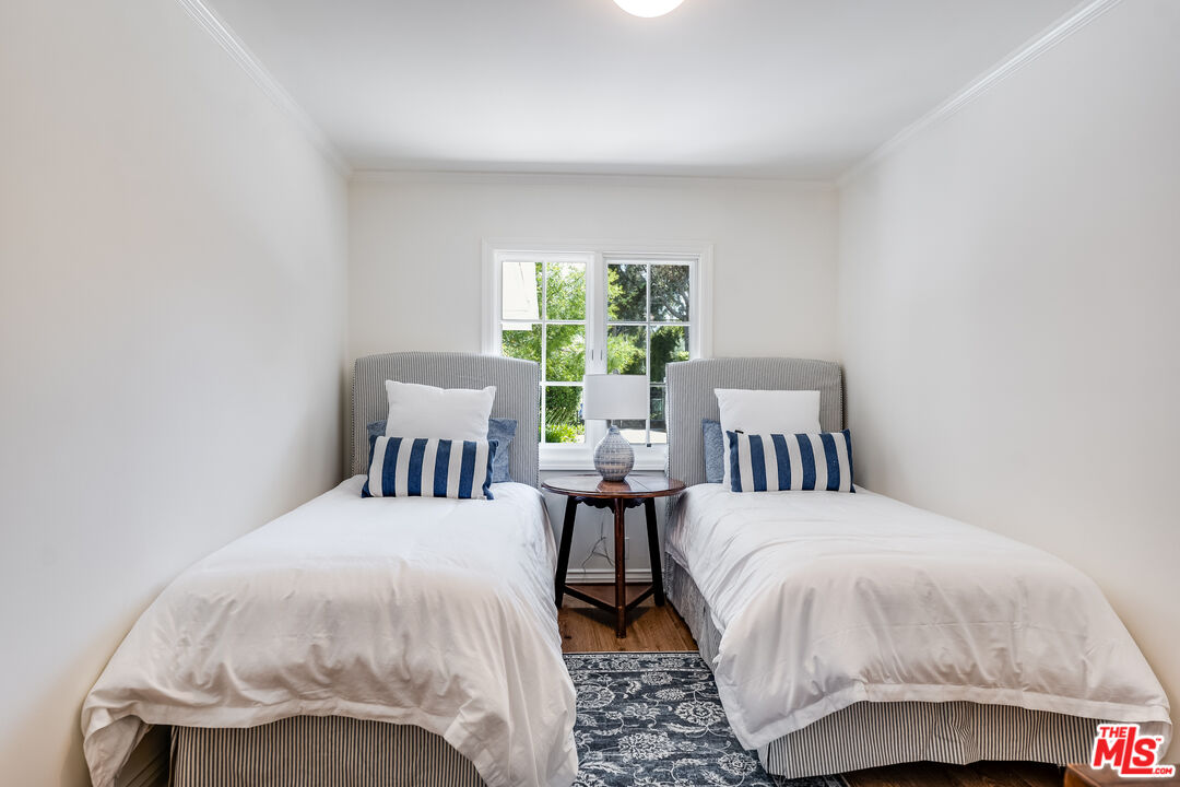 28925 Cliffside Drive Malibu, CA 90265 - Photo 35 of 62 a bedroom with a bed and a large window