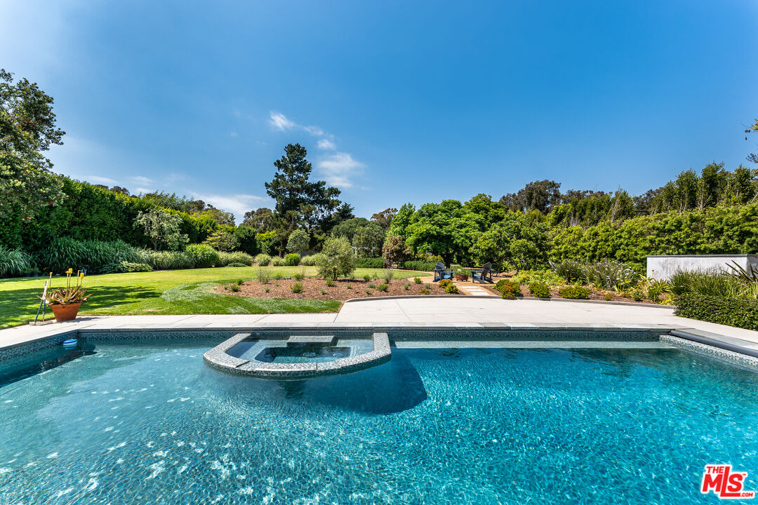 28925 Cliffside Drive Malibu, CA 90265 - Photo 41 of 62 a view of a swimming pool with a yard