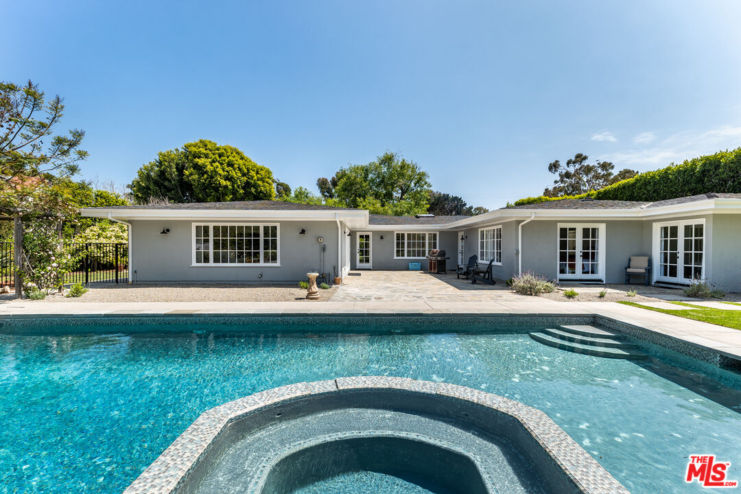 28925 Cliffside Drive Malibu, CA 90265 - Photo 6 of 62 a front view of a house with swimming pool having outdoor seating