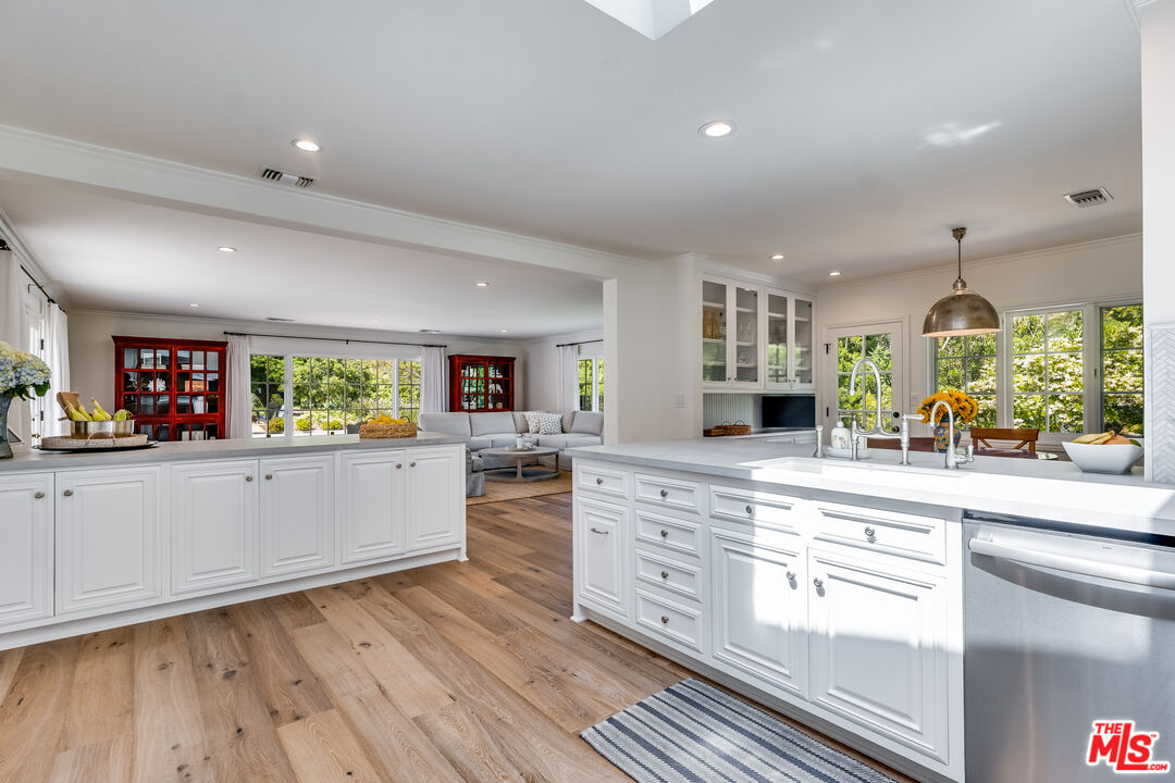 28925 Cliffside Drive Malibu, CA 90265 - Photo 9 of 62 a large kitchen with wooden floors and stainless steel appliances