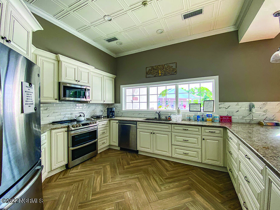 149 Clubhouse Road Sunset Beach, NC 28468 - Photo 60 of 61 pink-palace-interior-kitchen
