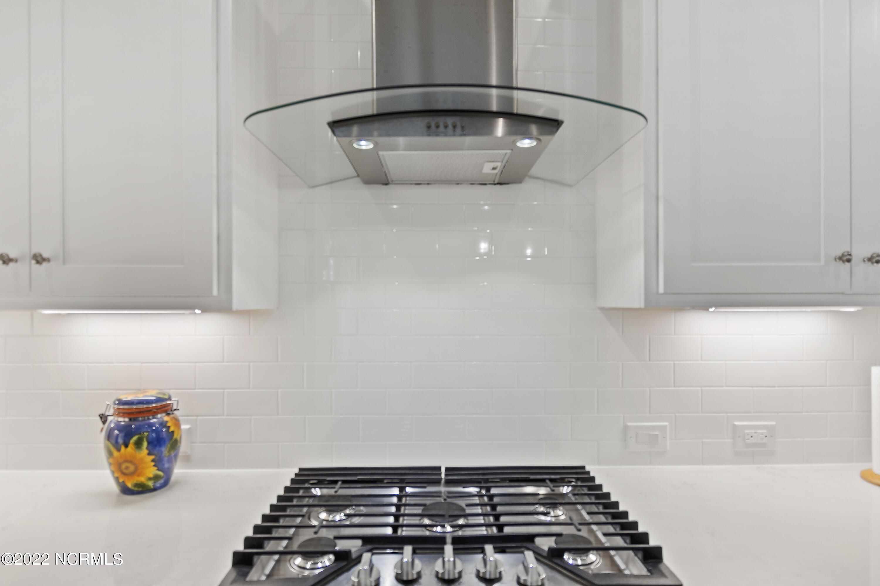 149 Clubhouse Road Sunset Beach, NC 28468 - Photo 10 of 61 Gas cooktop with hood