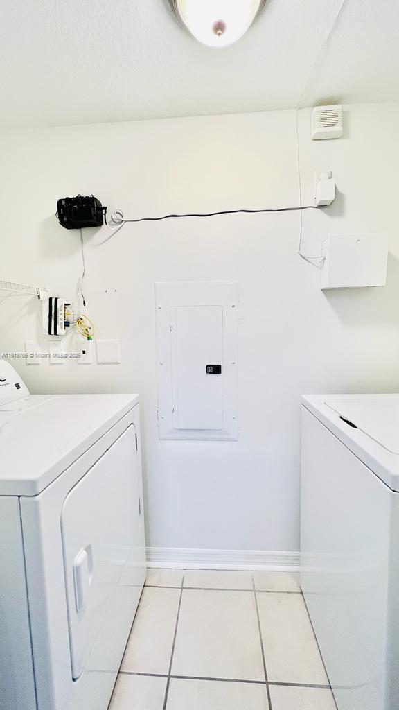 4115 San Marino Boulevard, Unit 101 West Palm Beach, FL 33409 - Photo 11 of 25 a bathroom with a sink and a shower