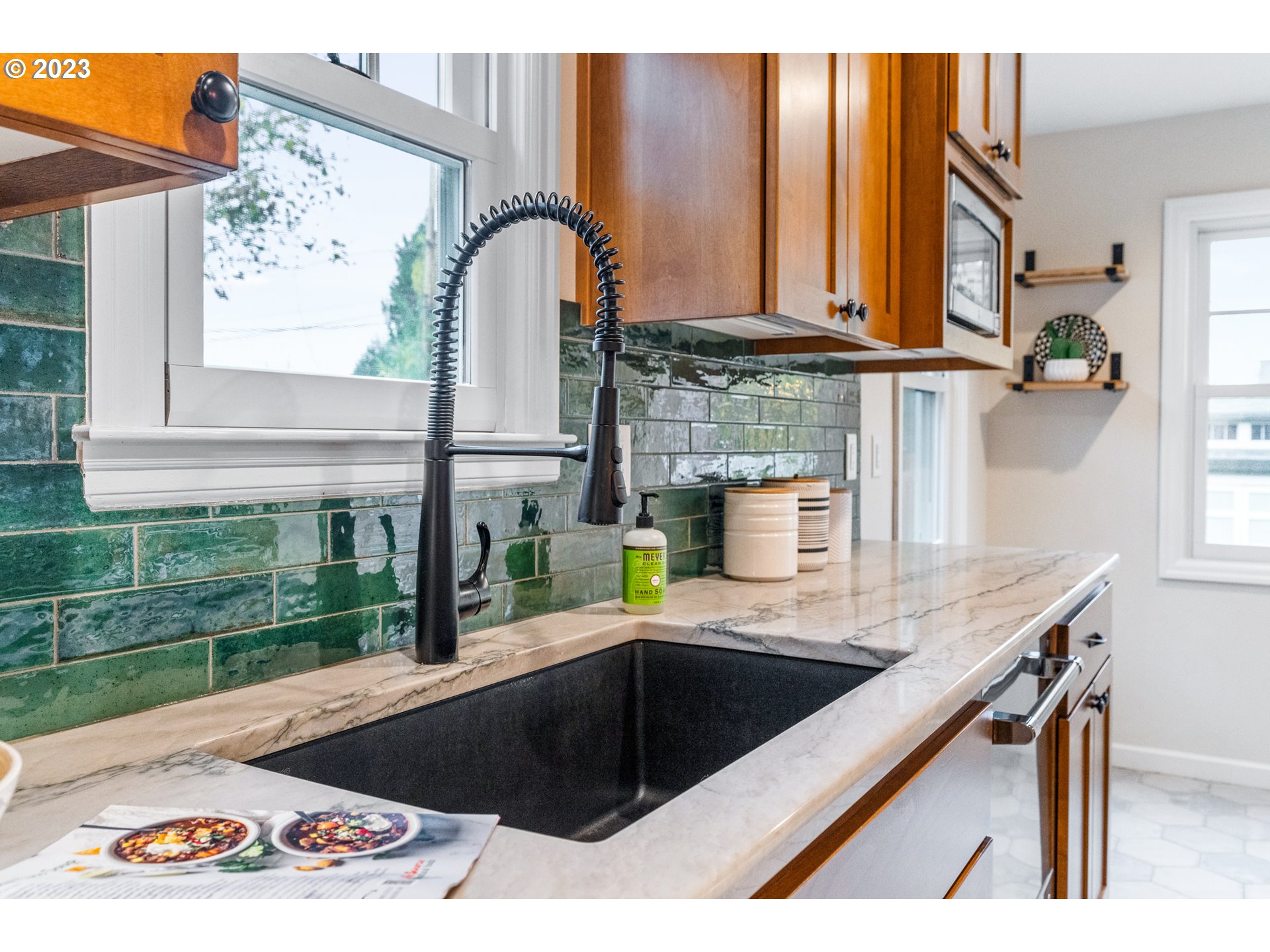 1565 18th Street Northeast Salem, OR 97301 - Photo 13 of 41 a kitchen that has a lot of cabinets in it