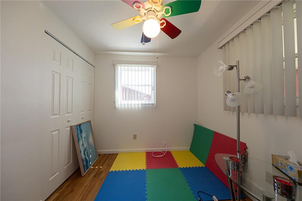 44 Highbury Road Cheswick, PA 15024 - Photo 15 of 36 FUN CEILING FAN ACCENTS THE THIRD BEDROOM. DOUBLE CLOSET AND STUNNING HARDWOOD FLOORS.