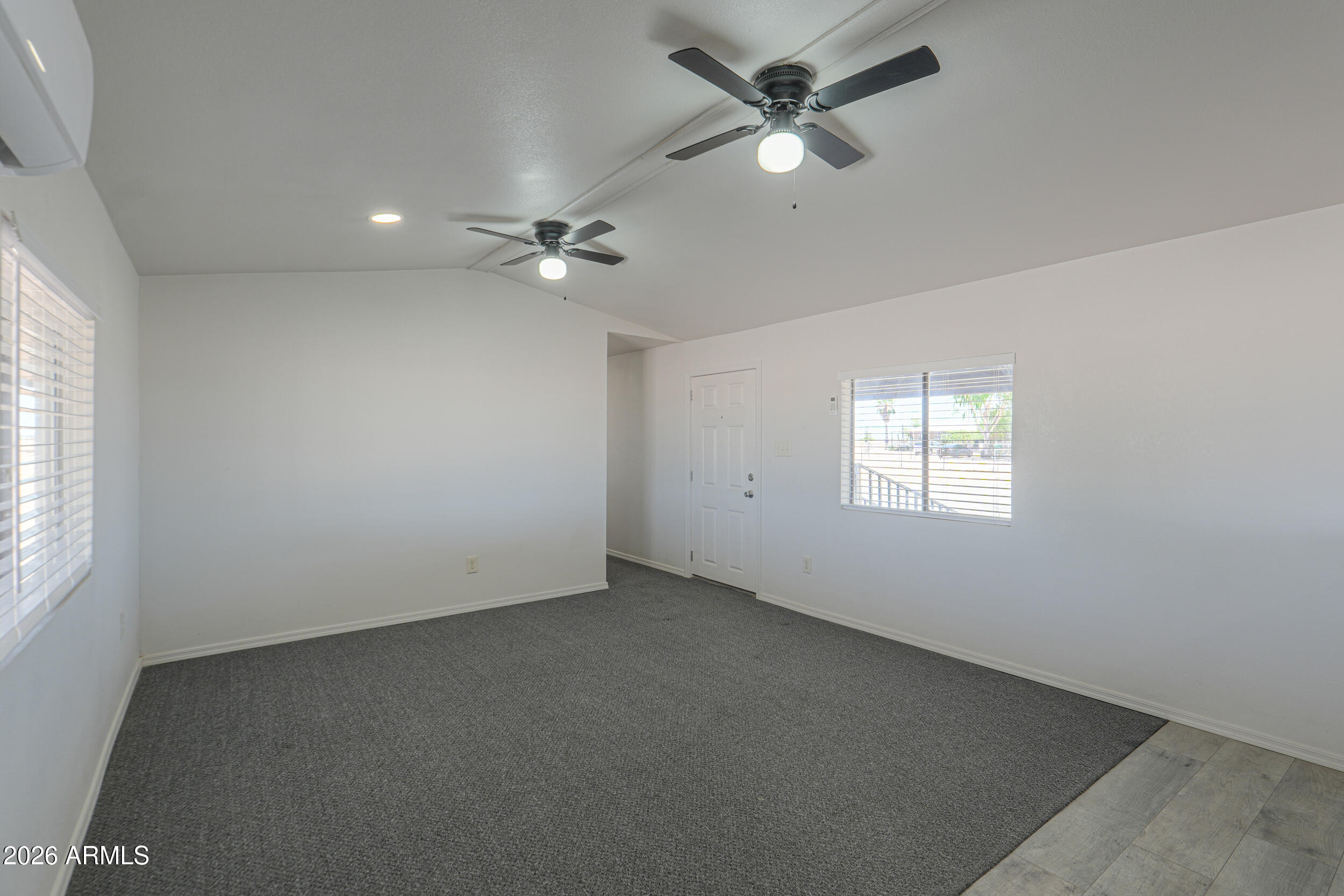 33776 West Siesta Road Stanfield, AZ 85172 - Photo 35 of 54 an empty room with a window and a fan