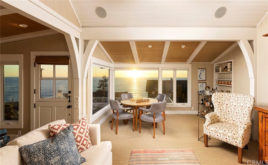 151 Rockledge Terrace Laguna Beach, CA 92651 - Photo 15 of 24 a living room with furniture and large windows