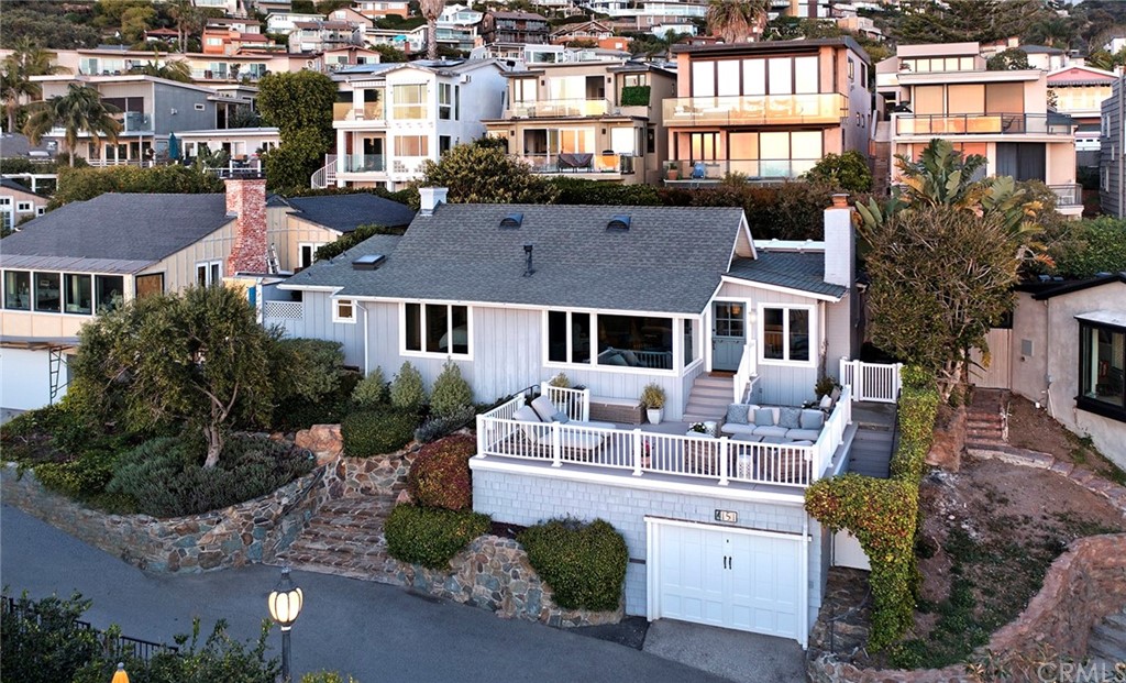 151 Rockledge Terrace Laguna Beach, CA 92651 - Photo 3 of 24 a front view of a house with a yard and potted plants