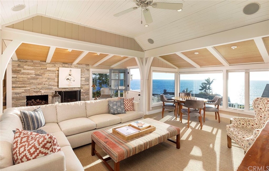 151 Rockledge Terrace Laguna Beach, CA 92651 - Photo 4 of 24 a living room with furniture fireplace and a large window