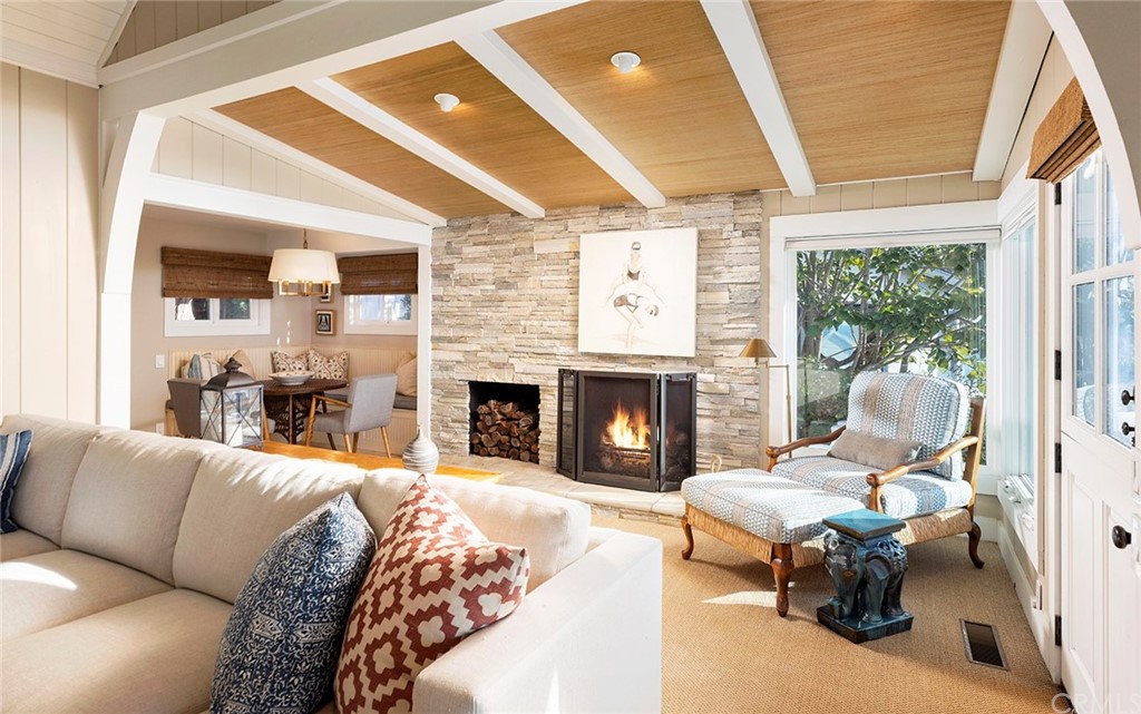 151 Rockledge Terrace Laguna Beach, CA 92651 - Photo 7 of 24 a living room with furniture and a fireplace