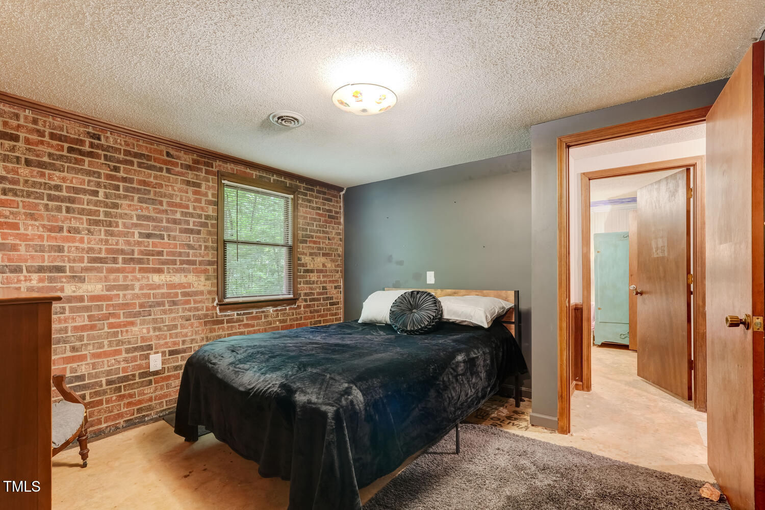 4272 Boyd Wright Road Burlington, NC 27215 - Photo 20 of 38 2nd bedroom, lovely brick accent walls.