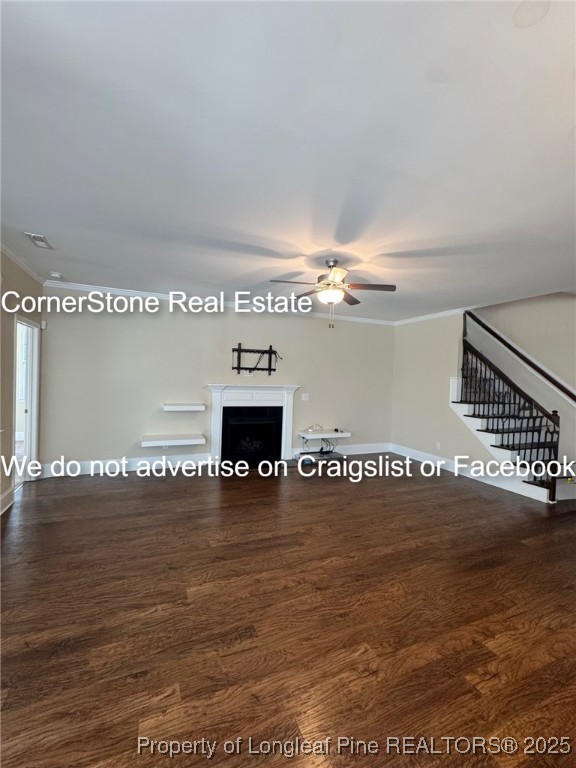 547 Micahs Way North Spring Lake, NC 28390 - Photo 16 of 26 a view of an empty room with wooden floor and a fireplace