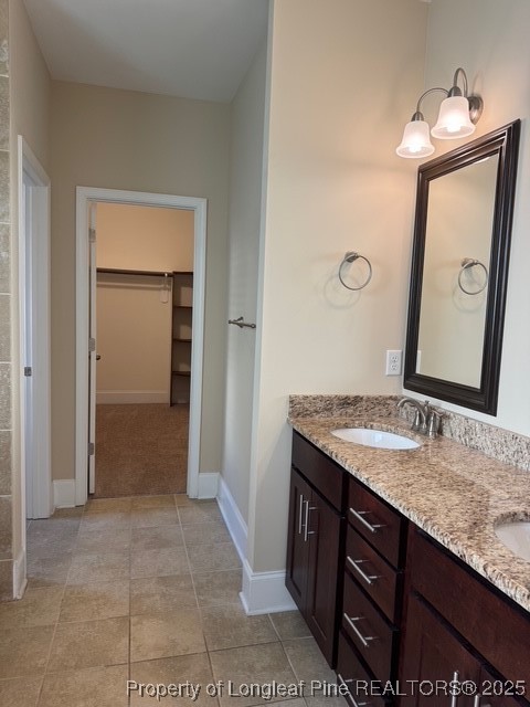 547 Micahs Way North Spring Lake, NC 28390 - Photo 20 of 26 a bathroom with a granite countertop sink and a mirror