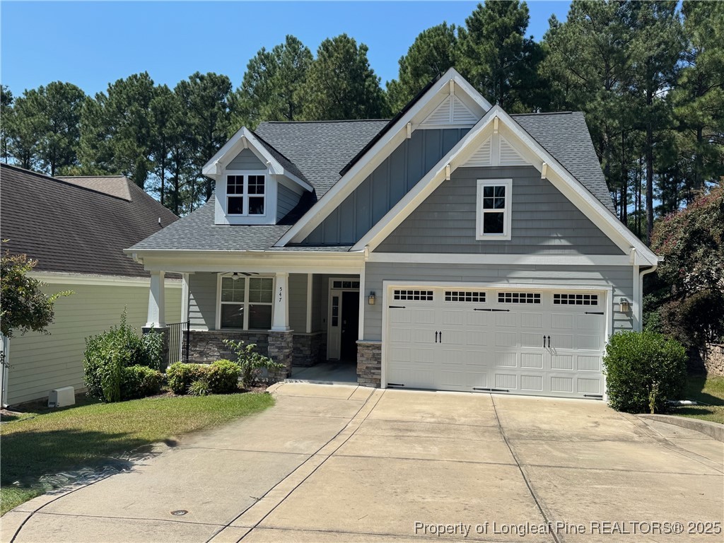 547 Micahs Way North Spring Lake, NC 28390 - Photo 3 of 26 a view of a white house with large windows