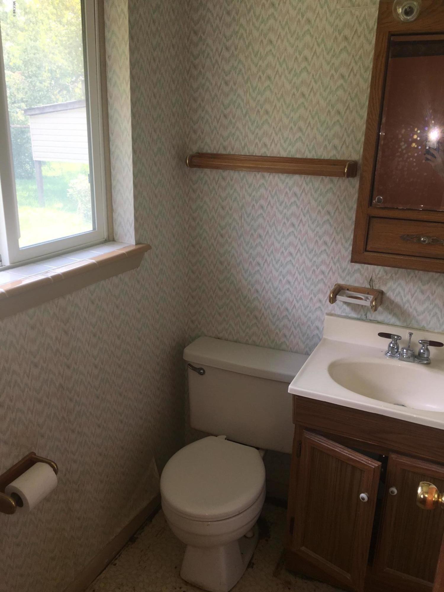 12319 Dedeaux Road Gulfport, MS 39503 - Photo 8 of 14 Master Half Bath