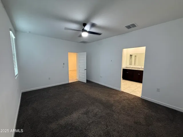 a bathroom with a double vanity sink a mirror and a shower