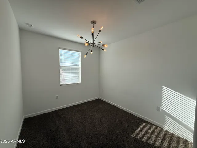a bathroom with a granite countertop sink a toilet and a mirror