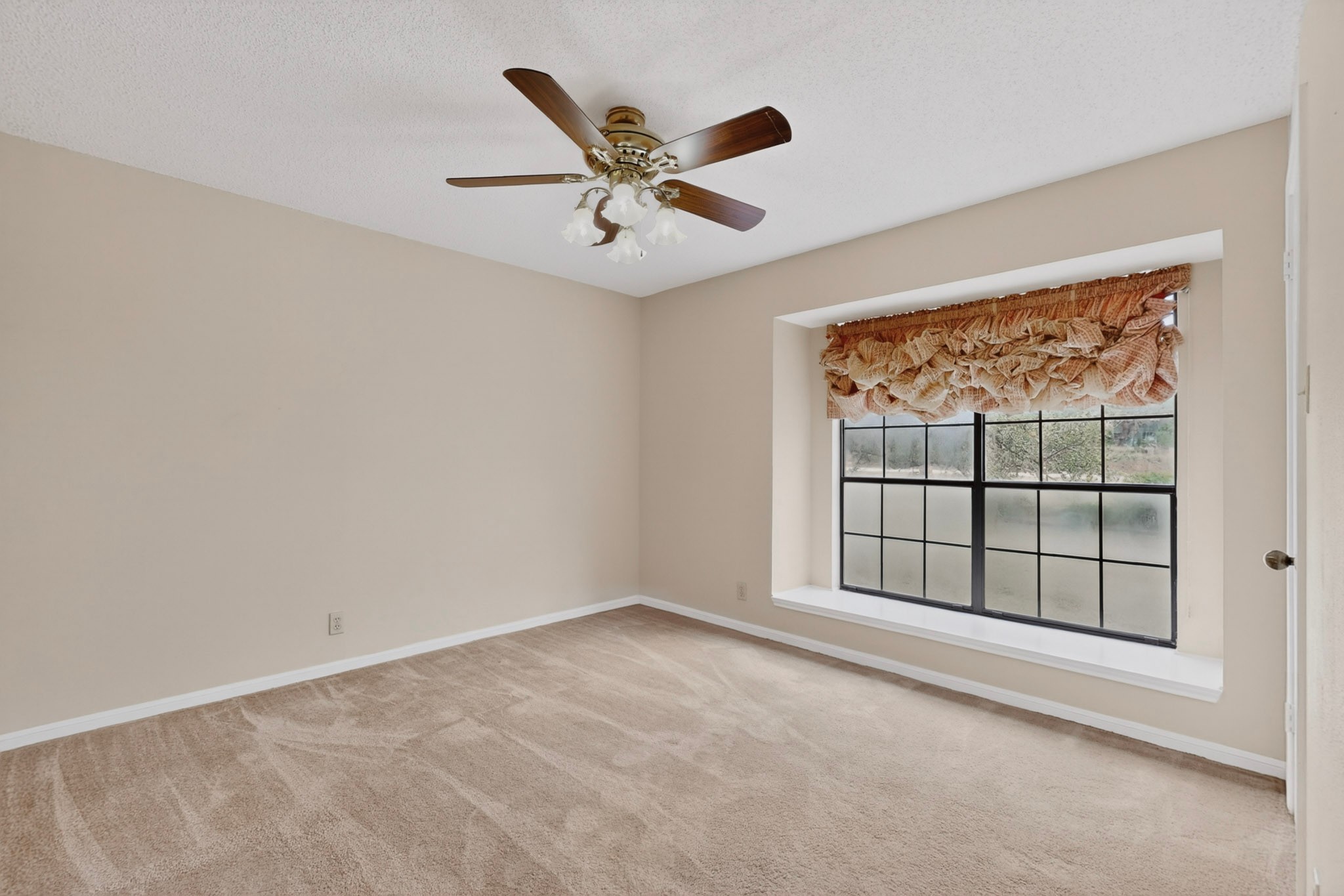 1003 Pier Branch Road Dripping Springs, TX 78620 - Photo 29 of 40 A cozy bedroom with a prominent window offers a peaceful retreat.