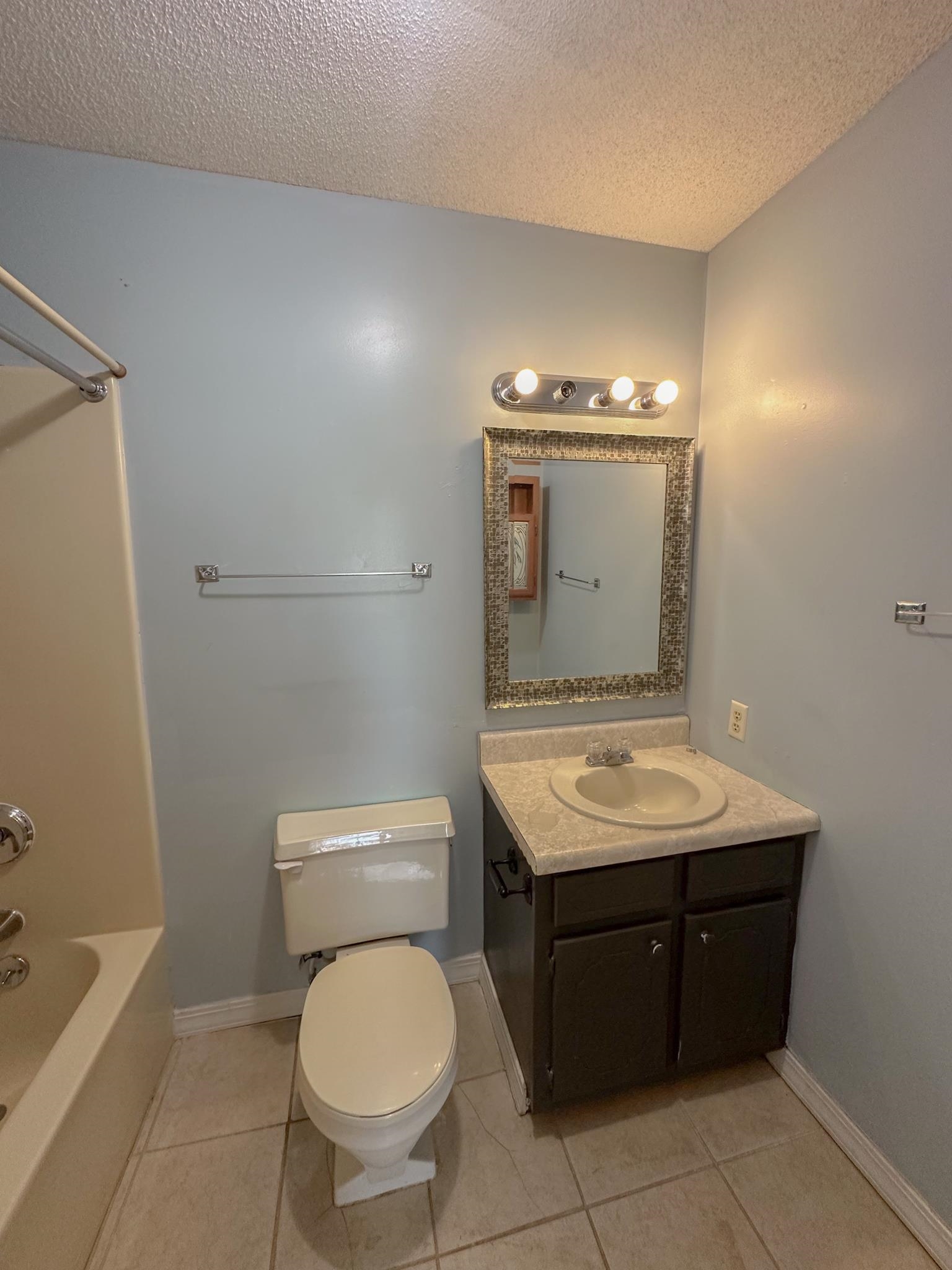 32 County Road 178 Iuka, MS 38852 - Photo 6 of 16 a bathroom with a toilet a sink and mirror
