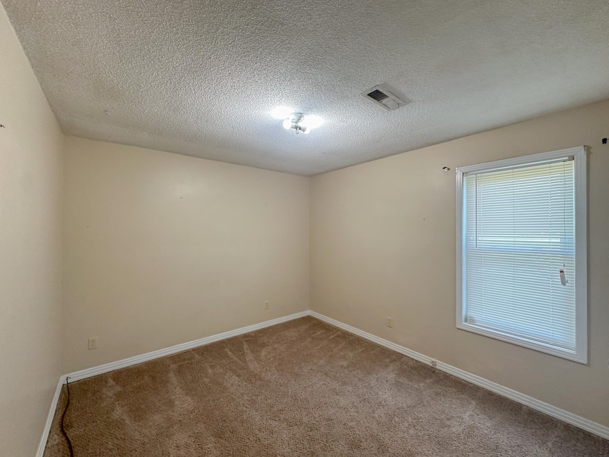 32 County Road 178 Iuka, MS 38852 - Photo 8 of 16 an empty room with a empty space and windows
