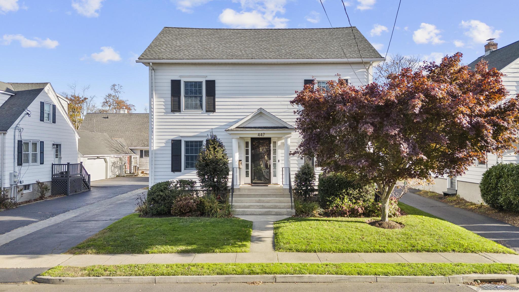 447 Reef Road Fairfield, CT 06824 - Photo 1 of 27 a front view of a house with garden