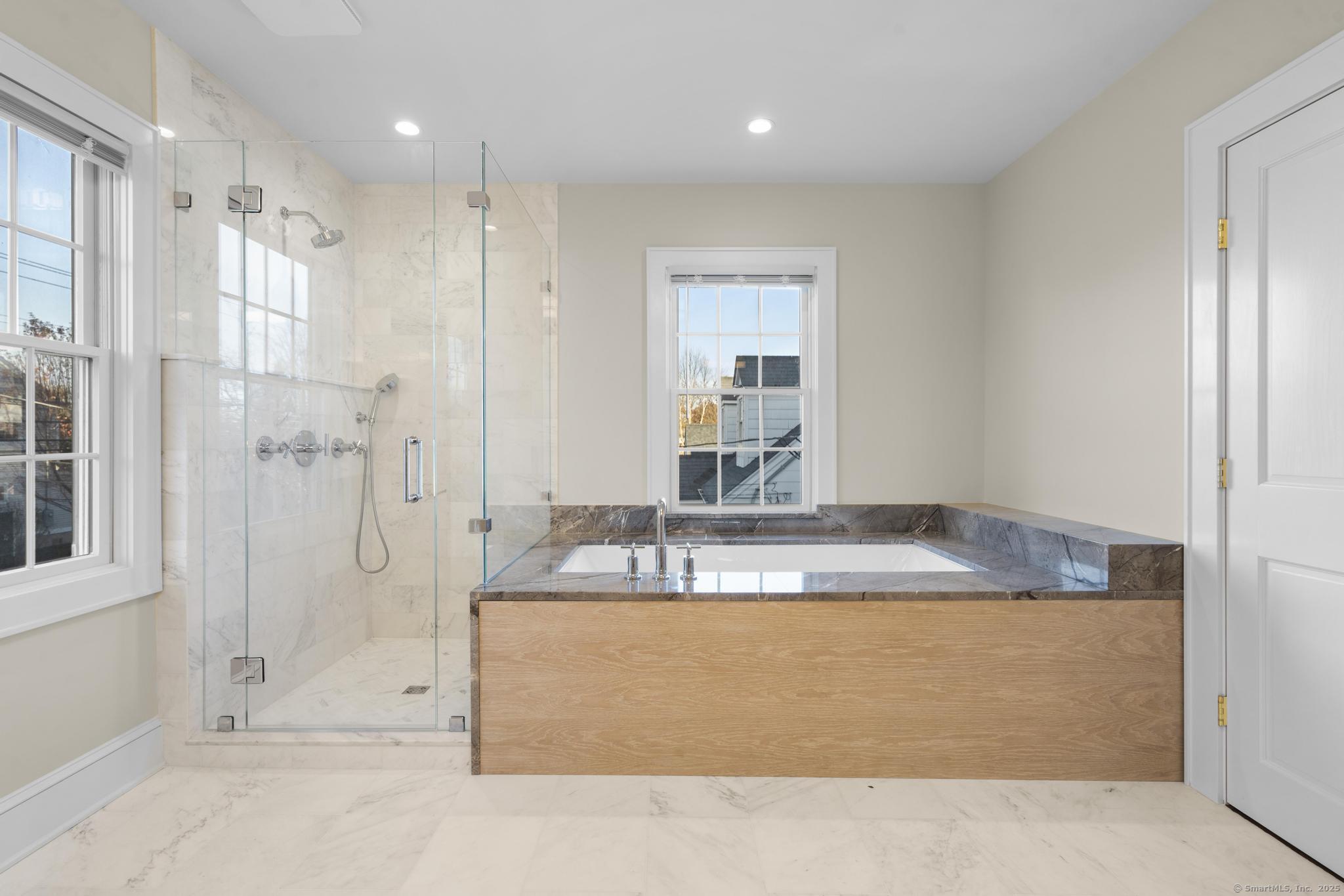 447 Reef Road Fairfield, CT 06824 - Photo 15 of 27 a bathroom with a granite countertop sink mirror and shower
