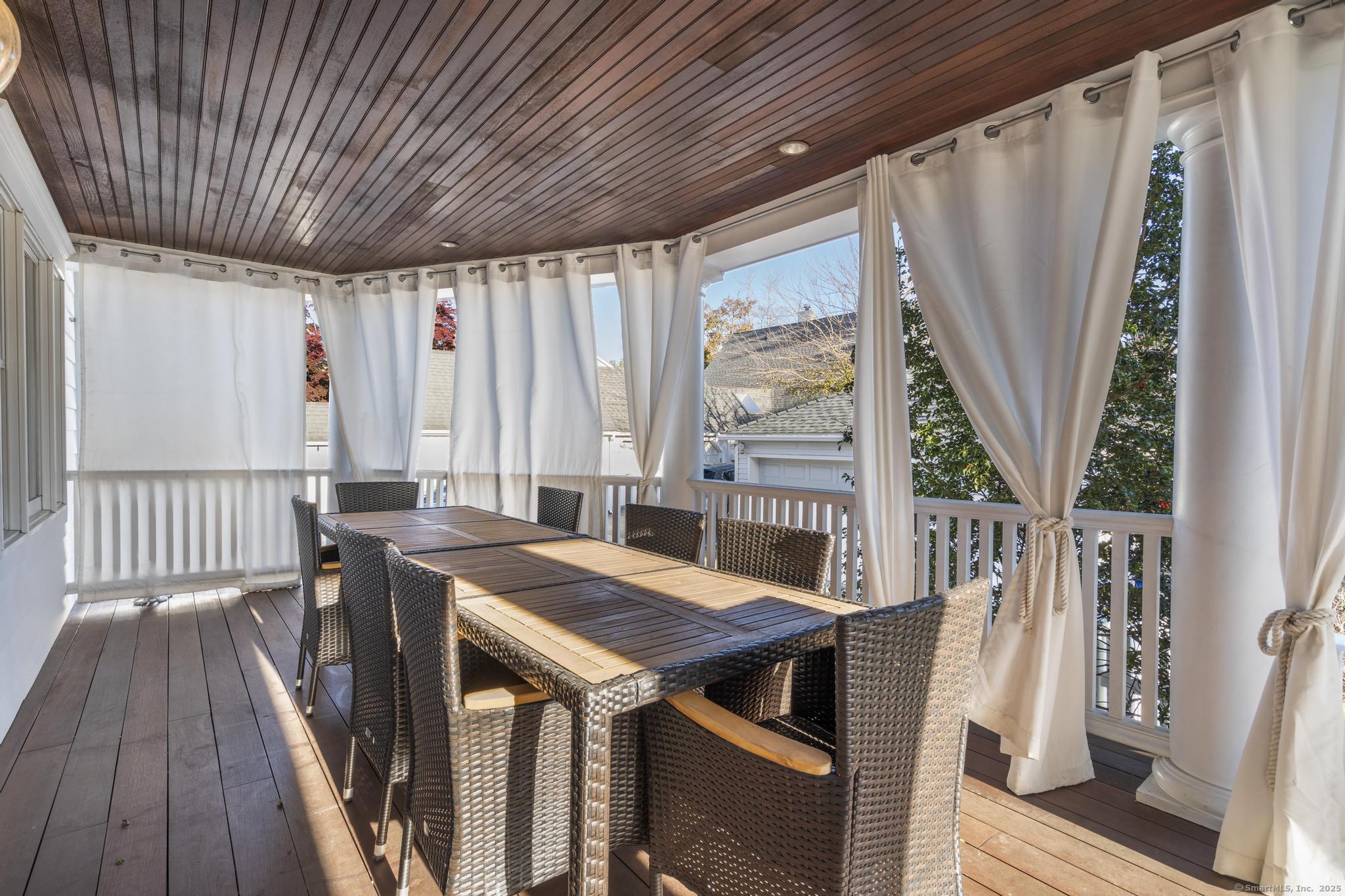 447 Reef Road Fairfield, CT 06824 - Photo 26 of 27 a view of a dining room with furniture window and wooden floor