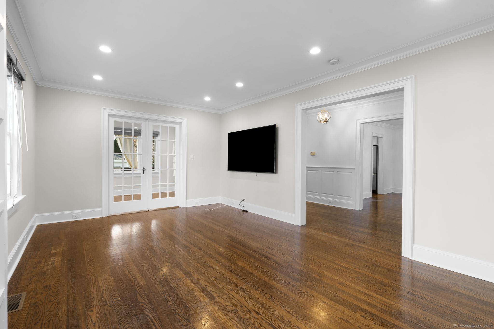 447 Reef Road Fairfield, CT 06824 - Photo 6 of 27 a view of a livingroom with wooden floor