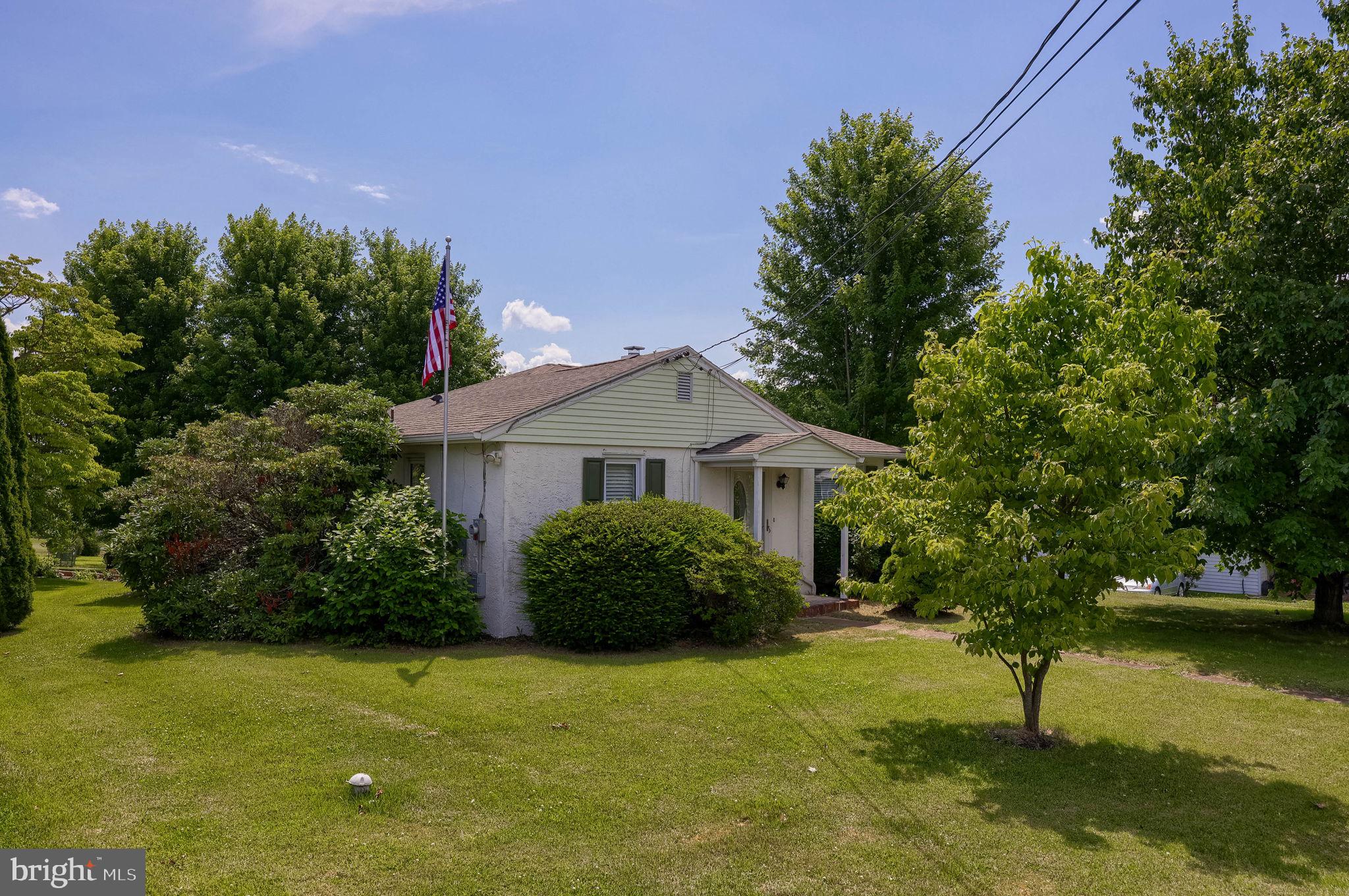355 Harry Road Coatesville, PA 19320 - Photo 2 of 48 Charming home with lush greenery.