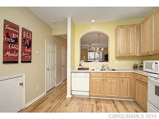 918 Azurine Circle, Unit 918 Fort Mill, SC 29708 - Photo 9 of 15 a open kitchen with a sink cabinets and a window