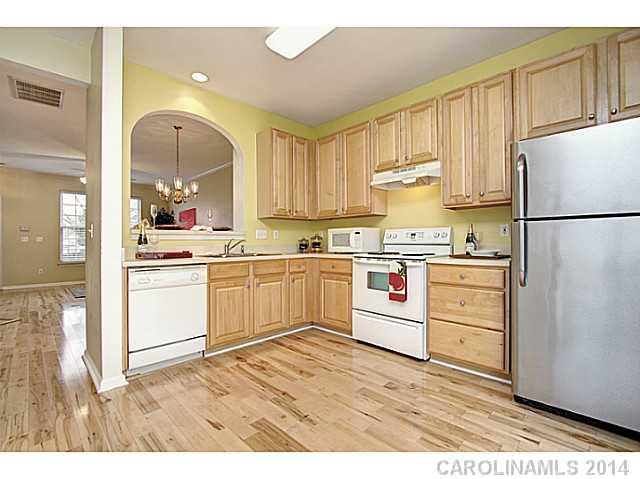 918 Azurine Circle, Unit 918 Fort Mill, SC 29708 - Photo 10 of 15 a kitchen with white cabinets and white appliances