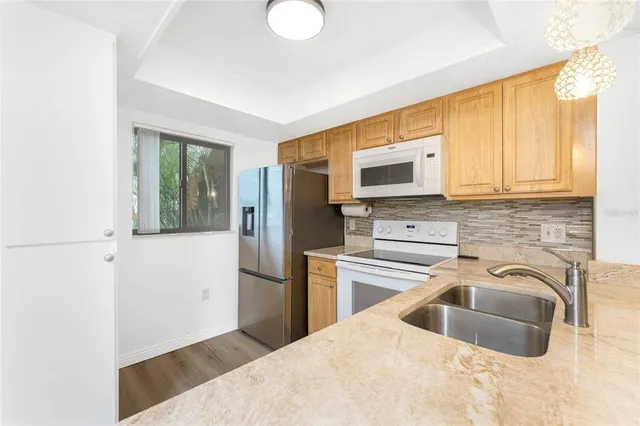 en empty room with a ceiling fan and a window