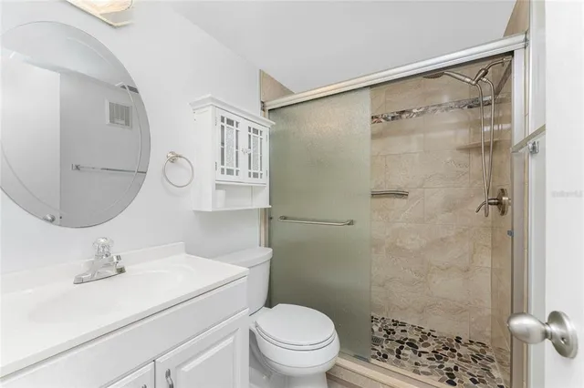 a kitchen with a refrigerator a sink a stove a microwave and cabinets