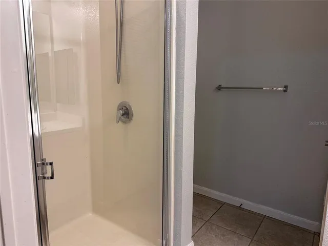 a view of a brick house with many windows