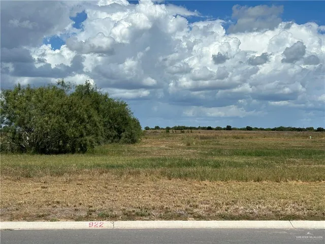 a view of a lake with a yard