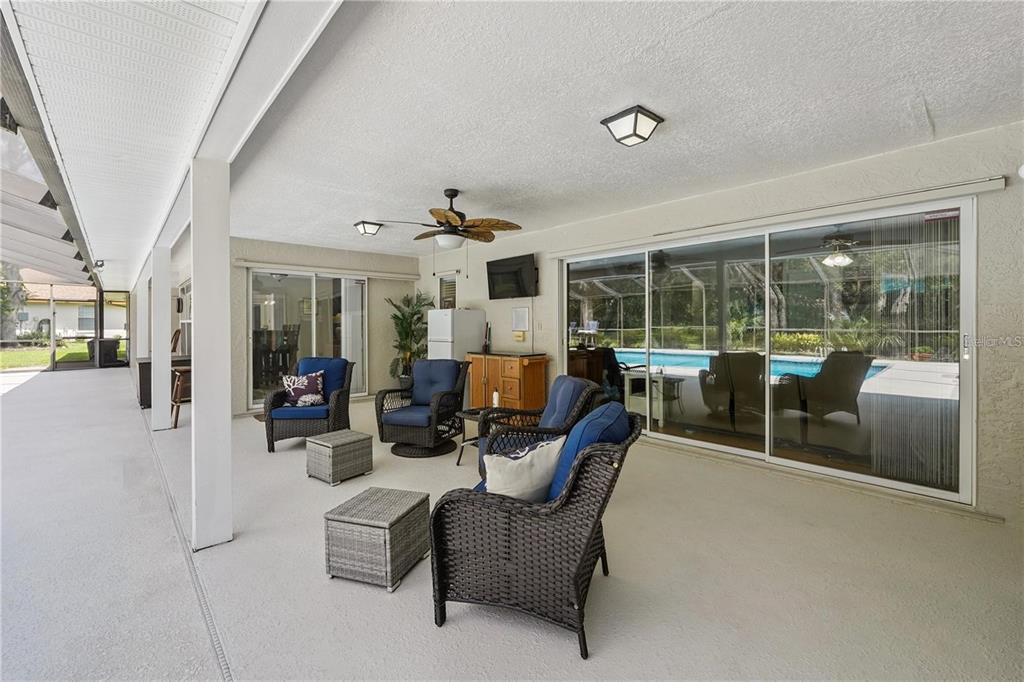 4603 Lake In The Woods Drive Spring Hill, FL 34607 - Photo 37 of 69 a view of a livingroom with furniture and white walls