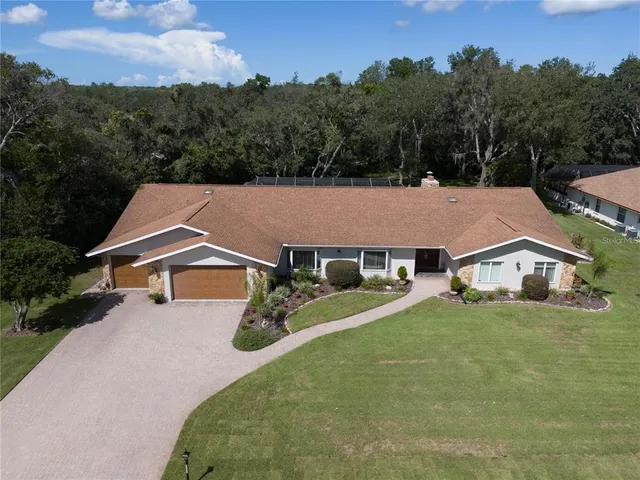 $650,000 | 4603 Lake In The Woods Drive, Spring Hill, FL 34607