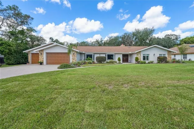 $650,000 | 4603 Lake In The Woods Drive, Spring Hill, FL 34607
