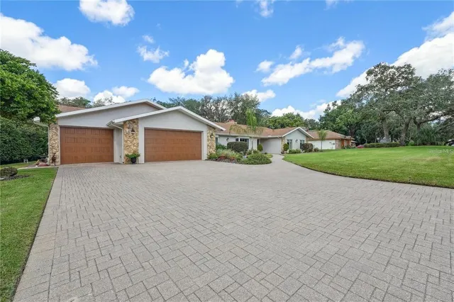 $650,000 | 4603 Lake In The Woods Drive, Spring Hill, FL 34607