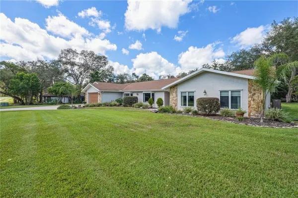 $599,900 | 4603 Lake In The Woods Drive, Spring Hill, FL 34607