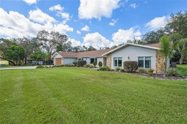 $650,000 | 4603 Lake In The Woods Drive, Spring Hill, FL 34607