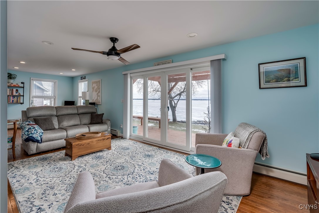 26995 3 Mile Point Road Lyme, NY 13622 - Photo 17 of 48 living room w/slider to deck overlooking the beaut